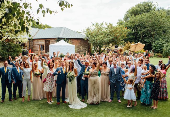 A group shot of family and friends at a wedding